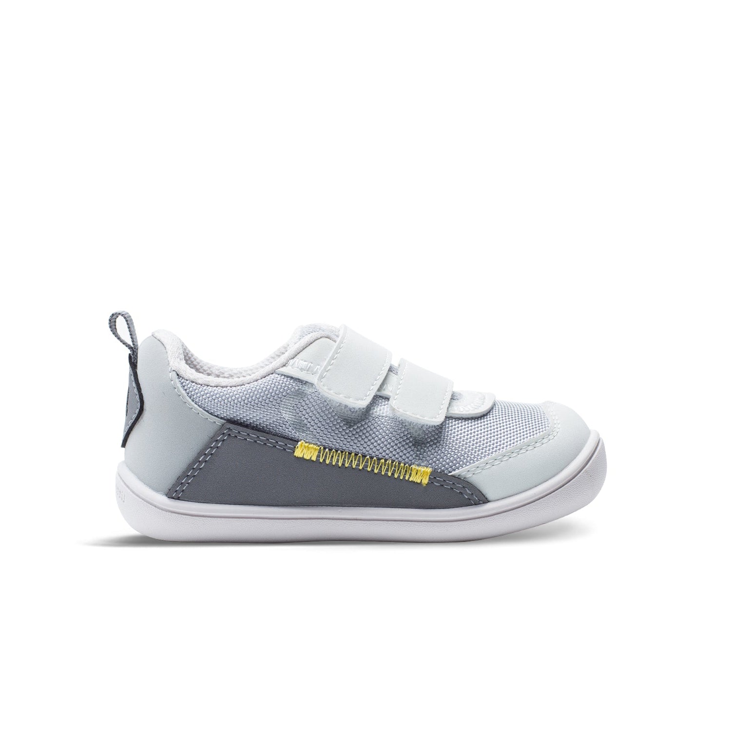 Children's sneaker with gray and white design on a white background